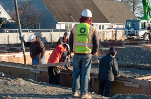 Concrete containing permanently-sequestered carbon is poured at Mateo Meadows