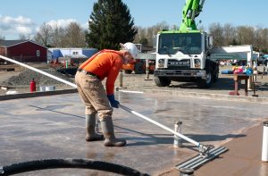 Concrete containing permanently-sequestered carbon is poured at Mateo Meadows