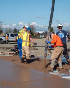 Concrete containing permanently-sequestered carbon is poured at Mateo Meadows